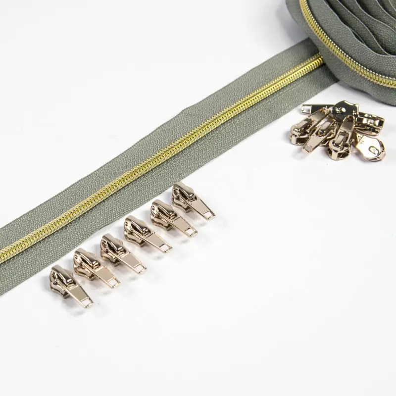Solange Der Vorrat Reicht Reißverschluss 6,5 mm Raupe grau / gold - 3 Meter plus 12 Zipper