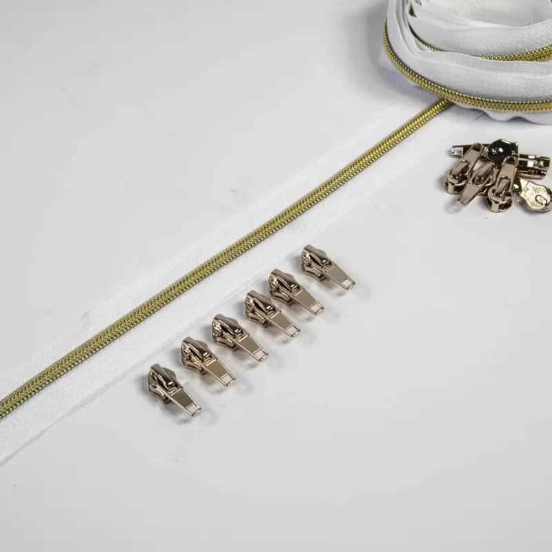 Reißverschluss 6,5 mm Raupe weiß / gold - 3 Meter plus 12 Zipper Finale Aktion